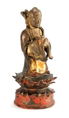 an image of a statue of a woman sitting on top of a flower