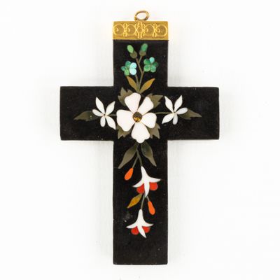 an image of a cross decorated with flowers and leaves on a white background