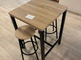 a table with two stools on it in a room