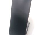 a cell phone that is sitting on top of a stand