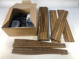 a cardboard box with a bunch of train tracks in it