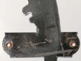 a picture of a knife stuck in to a piece of metal