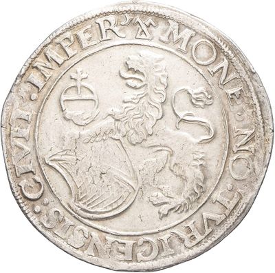a close up of a silver coin with a lion on it