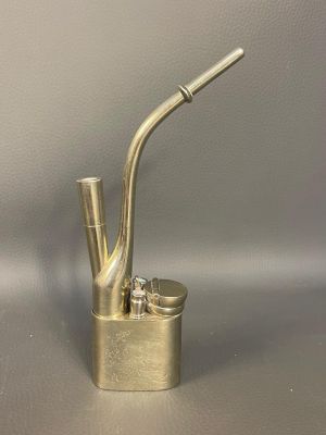 a metal pipe that is sitting on top of a table