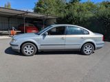 a picture of a silver car parked in a parking lot