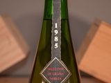 a bottle of wine that is sitting on a table