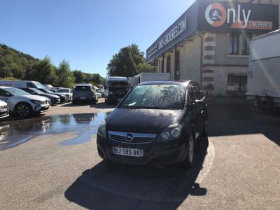 a black car that is parked in a parking lot