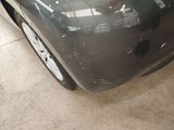 a close up of a car ' s front bumper and fender