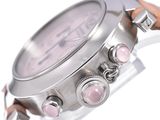 a close up of a wrist watch with pink stones on it