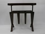 an image of a wooden table with a magazine rack on it