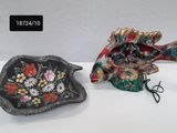 two decorative items that are sitting on a table