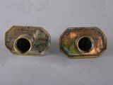 pair of antique brass candlesticks with black glass inserts