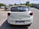 a white car parked on the side of the road