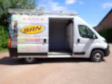 a van that is parked on the side of the road