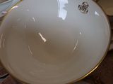 a lot of plates and bowls on the table