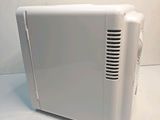 a white toaster sitting on a white counter top