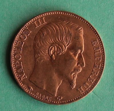 a close up of a coin with a man ' s face on it