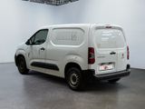 a white van that is parked in a room
