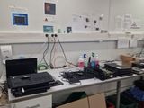 a picture of a lab with a lot of clutter on the desk