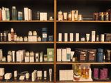 many different types of skin care products on the shelves