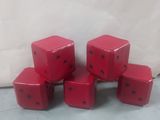 six red dice sitting on top of each other on top of a table