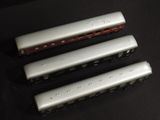 three train cars that are sitting on a table