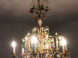 a chandelier that is hanging from the ceiling in the room