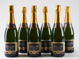 six bottles of champagne lined up in a row