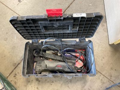 a tool box with tools inside of it on the floor