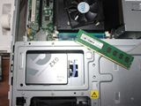 a computer with a ram card and a memory card on top of it