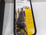 a black tray with a bike in it on a table