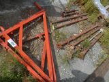 a pile of rusted metal items on the side of the road