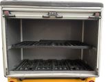 an image of an open oven with trays in it