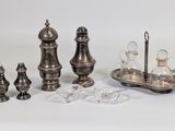 a lot of silver objects that are on a table