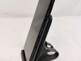 a cell phone that is sitting on a stand