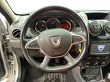 the interior of a car with a steering wheel and dashboard controls