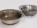 pair of antique silver plated bowls on a white background
