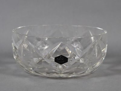 a close up of a clear glass bowl with a black diamond in the center