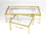 pair of brass and glass coffee tables