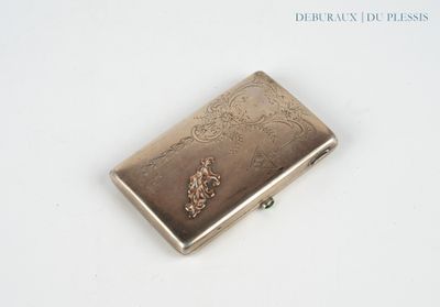 a silver cigarette case sitting on a white surface