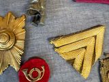 a lot of different types of badges on a table