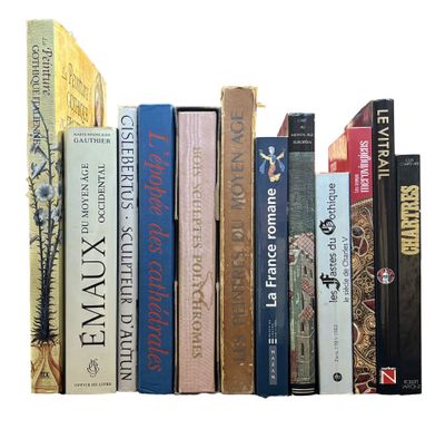 many books that are lined up together on a shelf