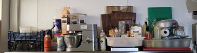 a kitchen with a bunch of appliances on the counter