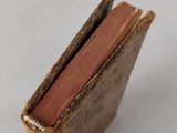 a miniature book that is sitting on a table