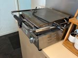 a stove with a pan on top of it in a kitchen