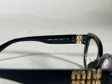 glasses with a black frame and gold details are on a white surface