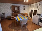 a kitchen with a table and chairs in it