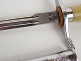 a close up of a knife and a hammer on a table