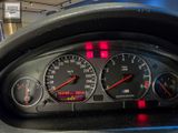 a close up of a car dashboard with various gauges