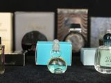 a lot of perfume bottles that are on a table